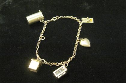 Appraisal: karat yellow gold charm braceletDisplays five charms of varying size