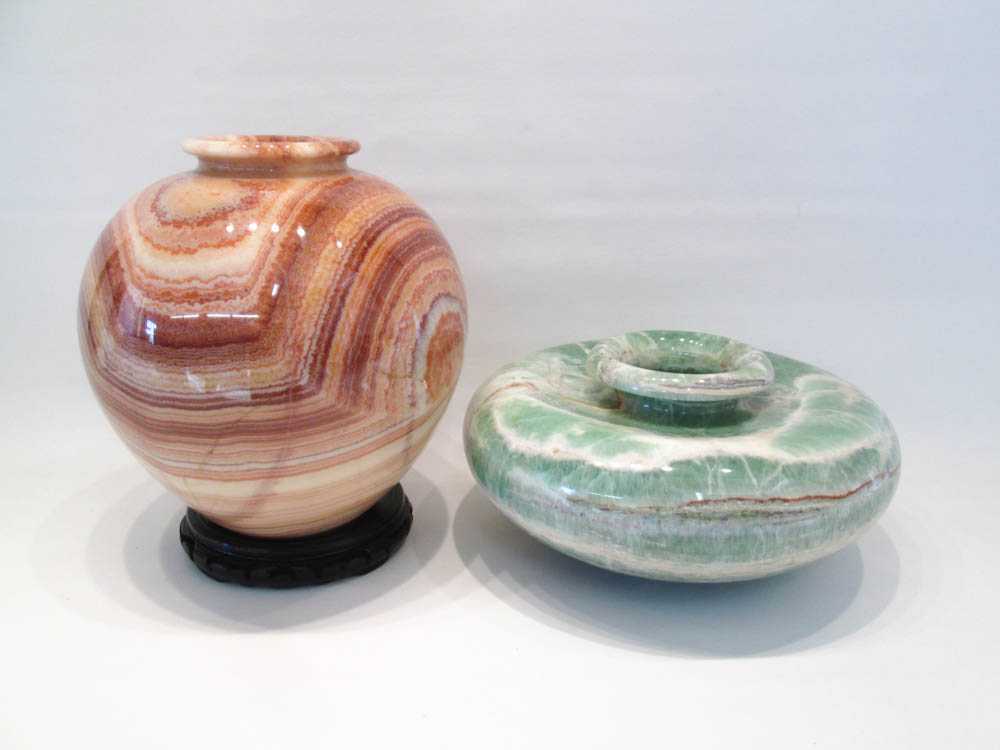 Appraisal: TWO CARVED STONE VASES the first green vase of compressed