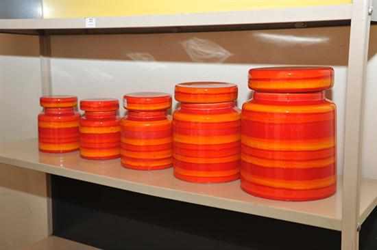 Appraisal: A FIVE PIECE BALDELLI RED AND ORANGE GLAZED LIDDED JAR