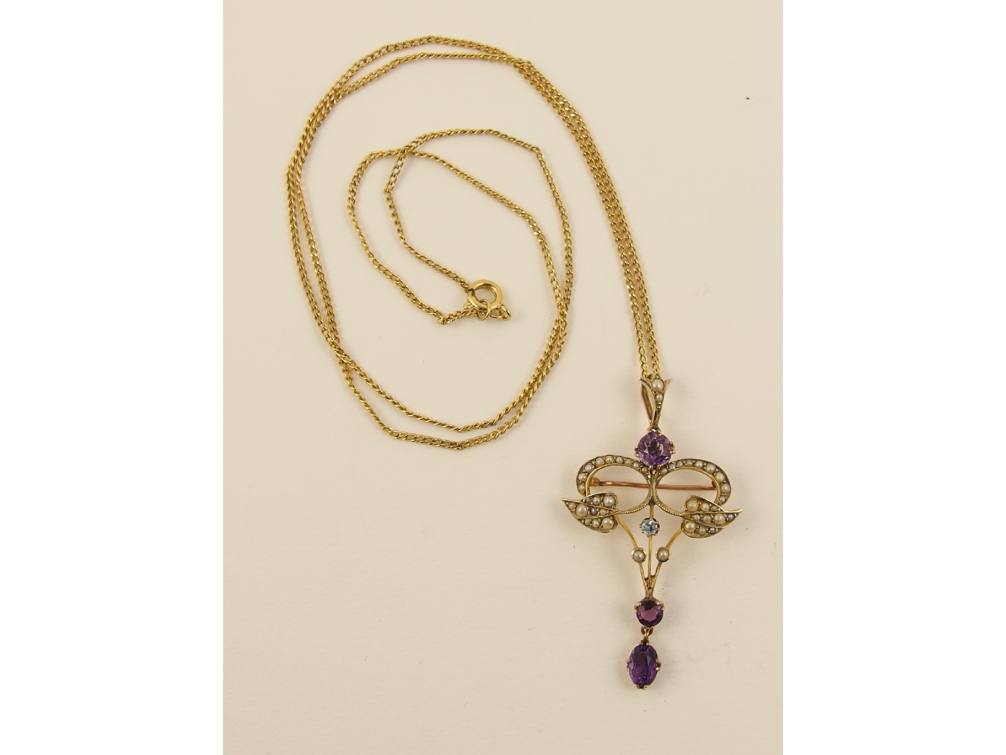 Appraisal: A ct Edwardian amethyst pearl and aquamarine set pendant brooch