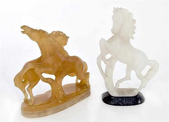 Appraisal: Carved soapstone figures of rearing stallions white carved figures H