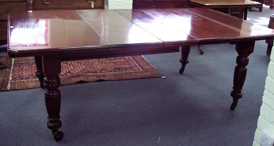 Appraisal: A late Victorian mahogany dining table with fluted legs fitted