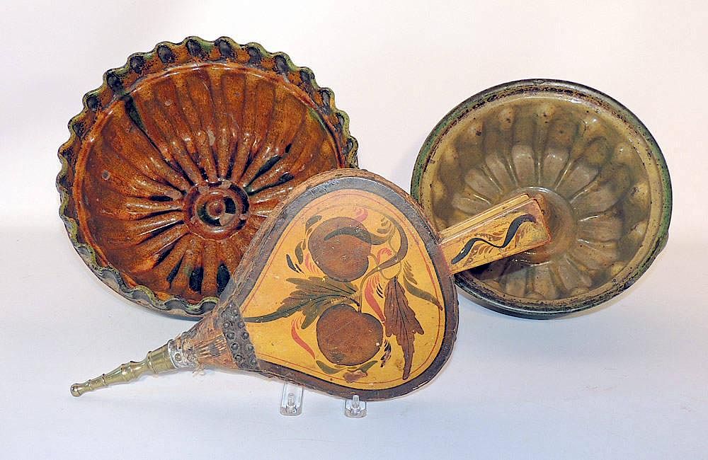 Appraisal: Two Earthenware Food Molds and Bellows th Century molds Together