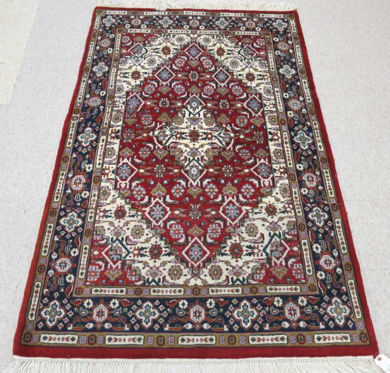 Appraisal: HAND KNOTTED ORIENTAL AREA RUG Indo-Persian Herati floral and central