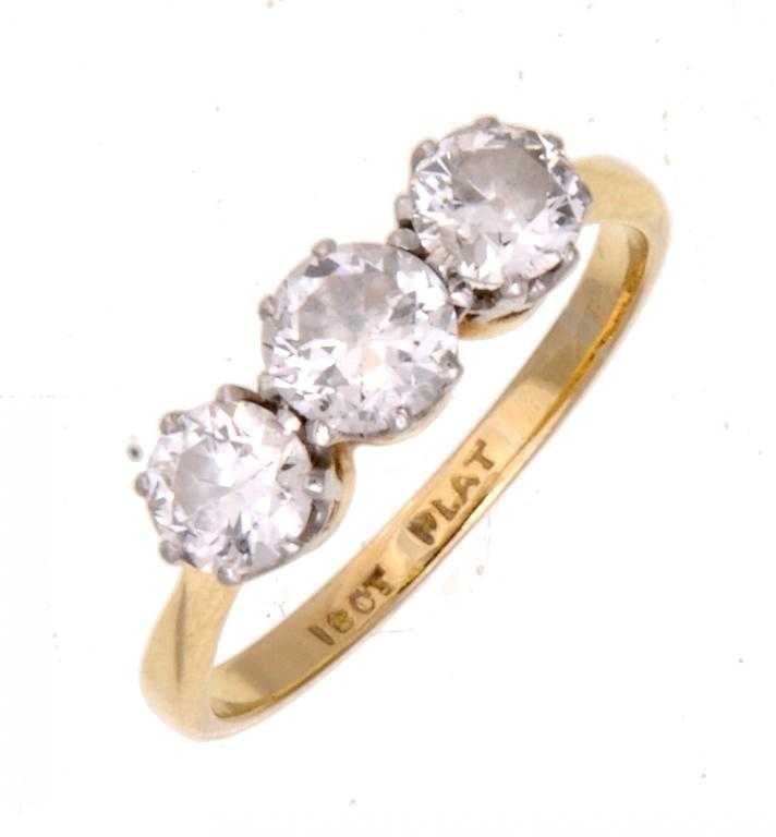 Appraisal: A DIAMOND THREE-STONE RING gold hoop marked ct