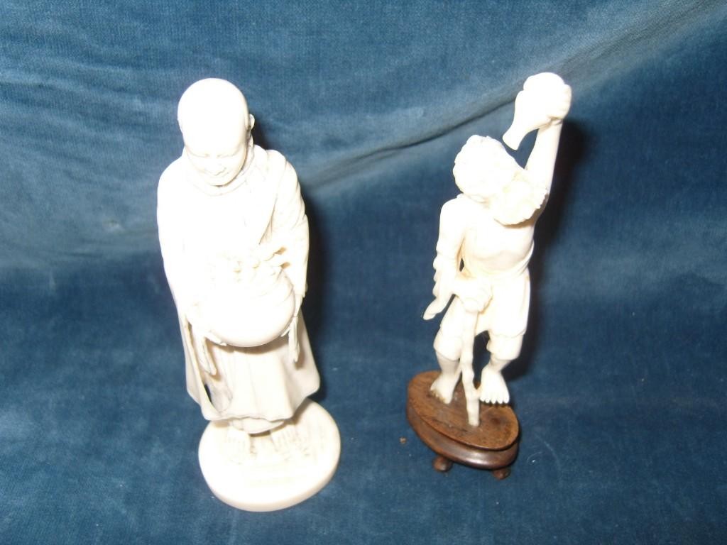 Appraisal: An eastern carved ivory figure of a robed gentleman holding