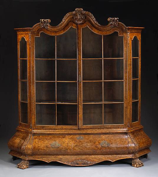 Appraisal: A Dutch Rococo style walnut vitrine cabinet last quarter th