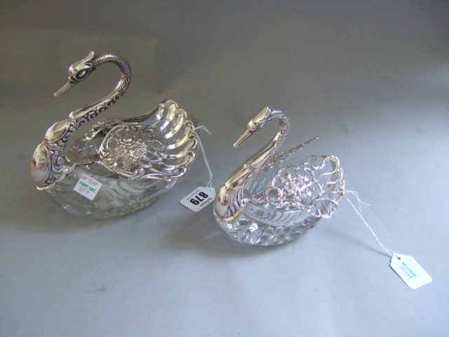 Appraisal: Two silver mounted faceted glass table ornaments designed as swans