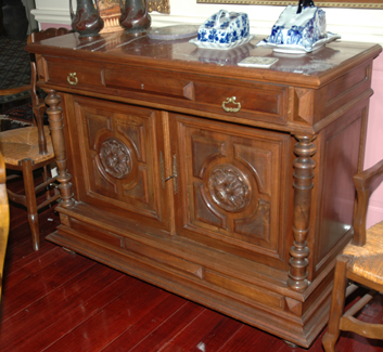 Appraisal: A FRENCH WALNUT BUFFET The rectangular rouge marble top above