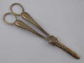 Appraisal: A pair of Victorian silver grape scissors with beaded handles