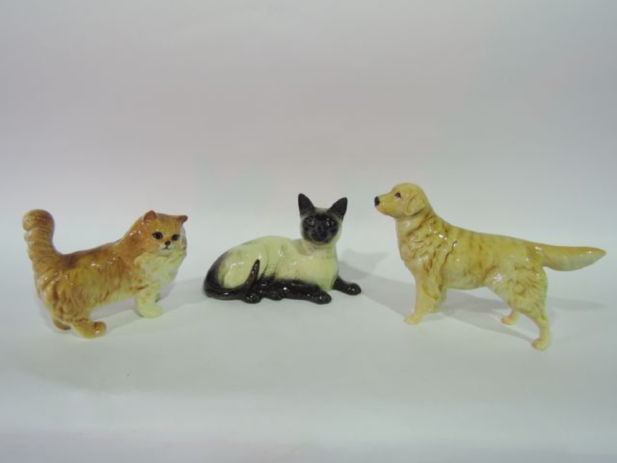 Appraisal: Three Beswick animals comprising a long haired ginger cat a