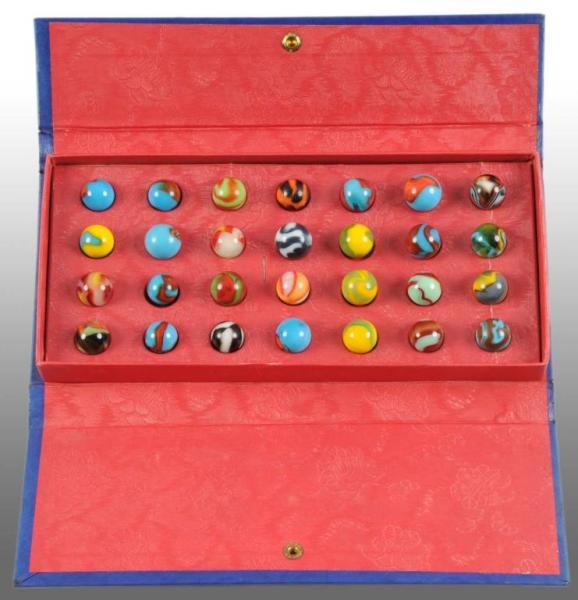 Appraisal: Lucky Boy Champion Marble Set Description Includes Peltier marbles Condition