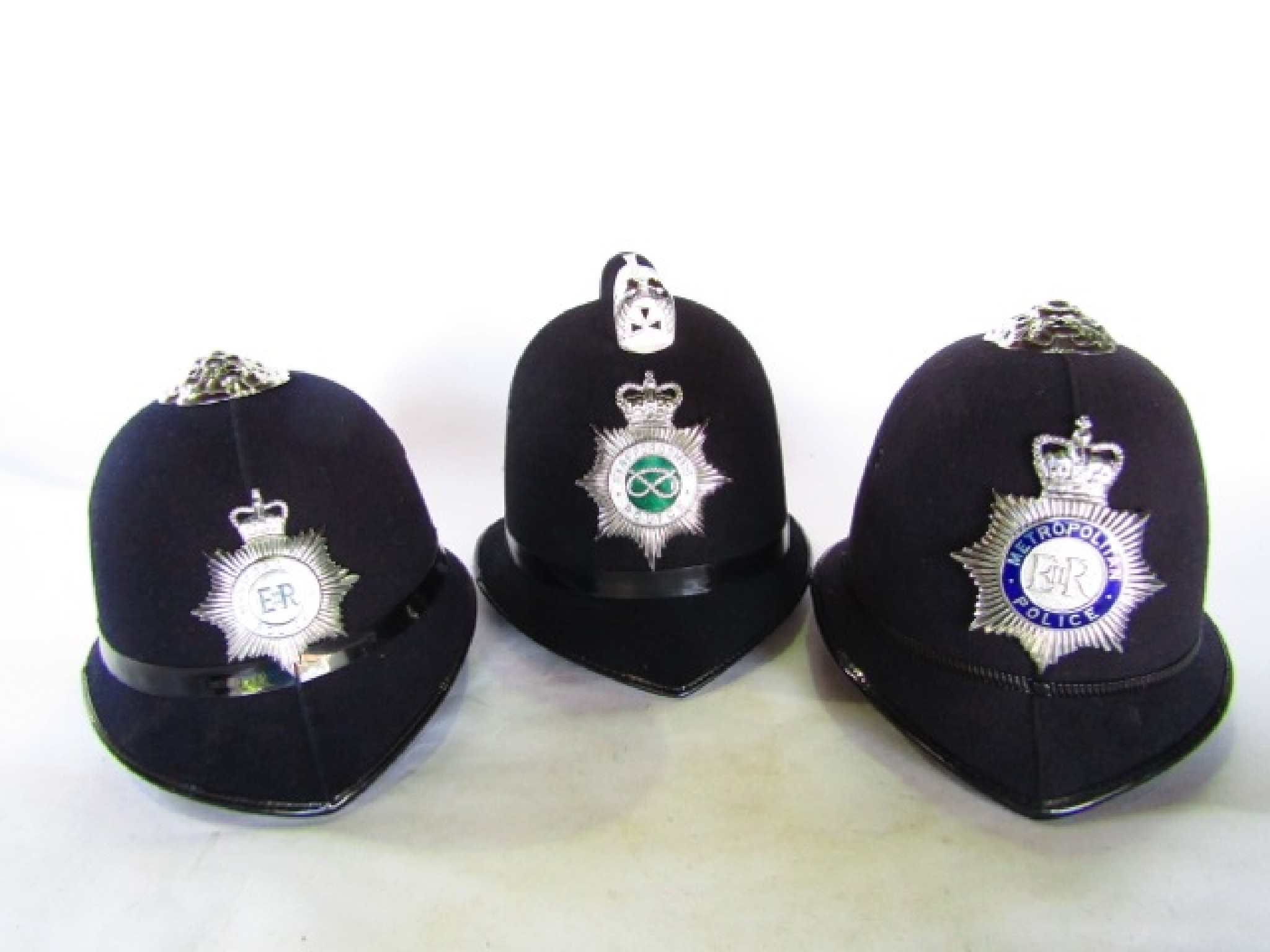 Appraisal: A trio of police helmets two with Metropolitan Police insignia