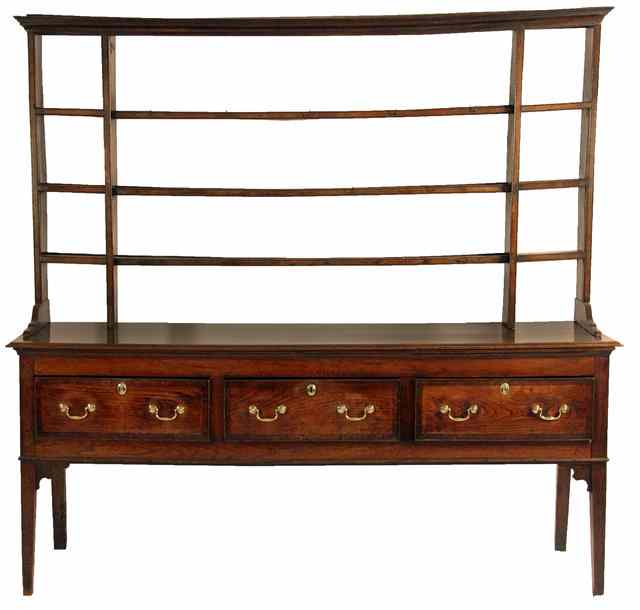 Appraisal: An oak dresser the associated rack upon a base with