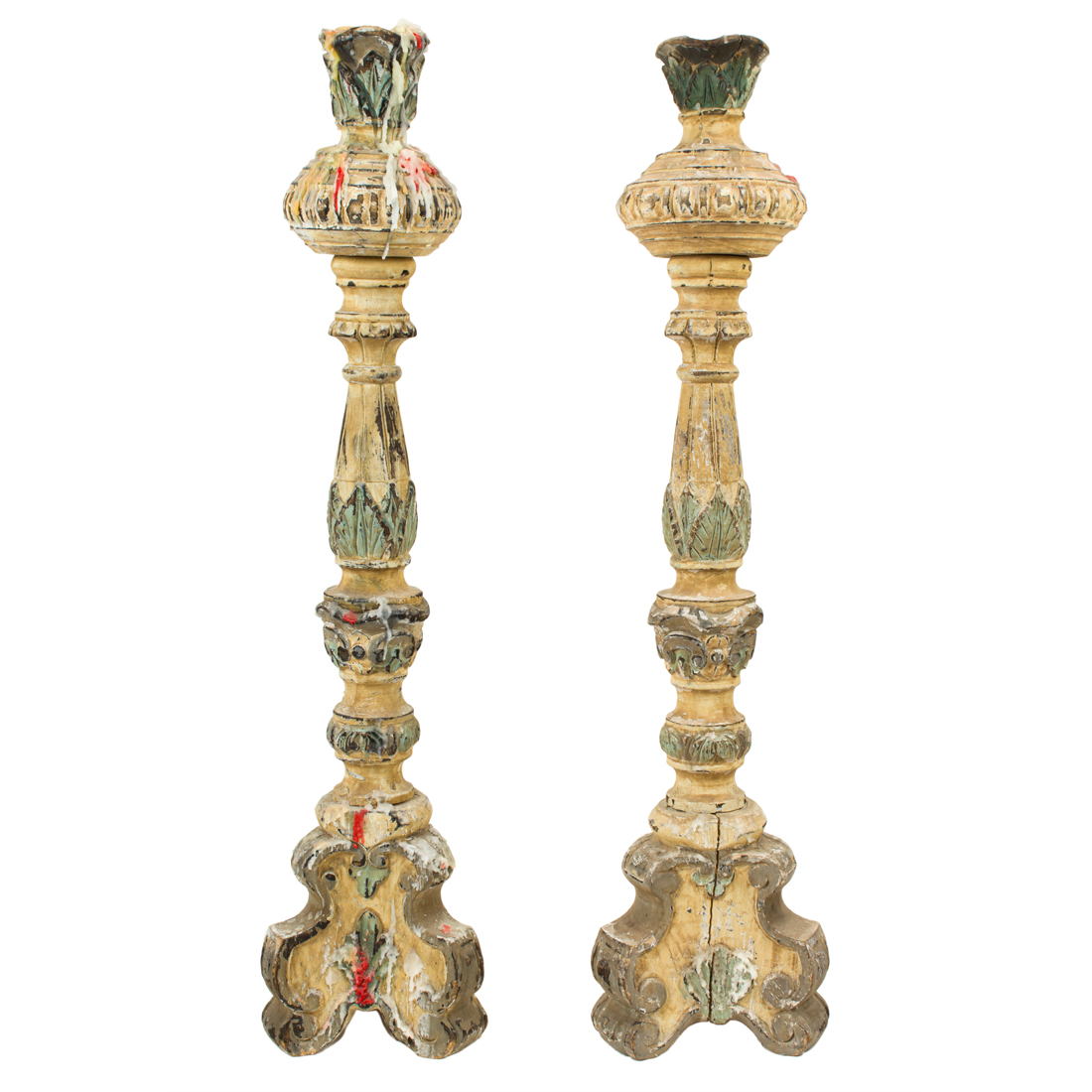 Appraisal: A PAIR OF CARVED AND PAINT DECORATED CANDLE PRICKETS IN