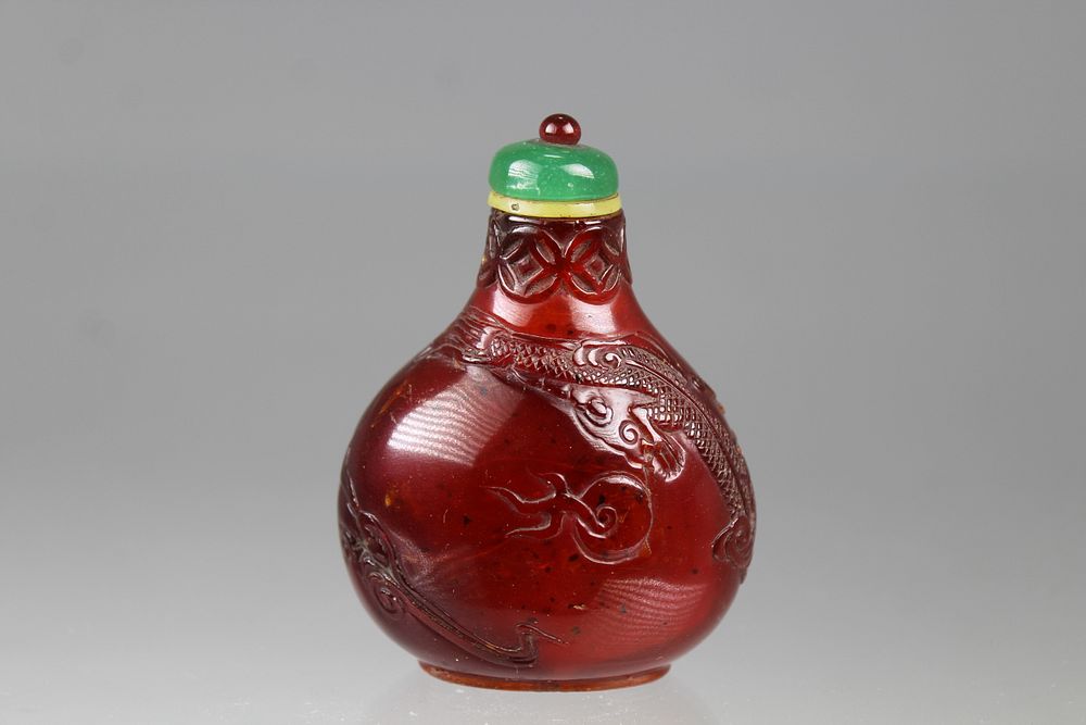 Appraisal: Carved Chinese Dragon Amber Snuff Bottle Carved Chinese Dragon Amber