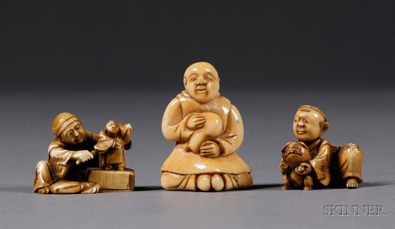 Appraisal: Three Ivory Netsuke th century a puppeteer a child with