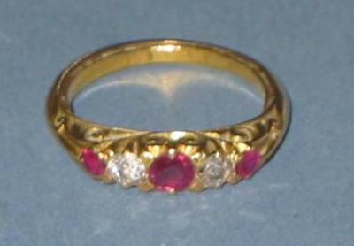 Appraisal: A RUBY AND DIAMOND RING comprising three rubies with diamonds