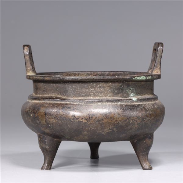 Appraisal: Chinese bronze tripod censer with molded handles octagonal rim and