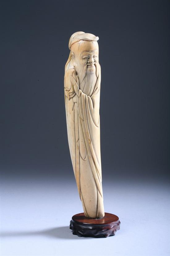 Appraisal: CHINESE IVORY FIGURE OF IMMORTAL Ming Dynasty Standing holding peach