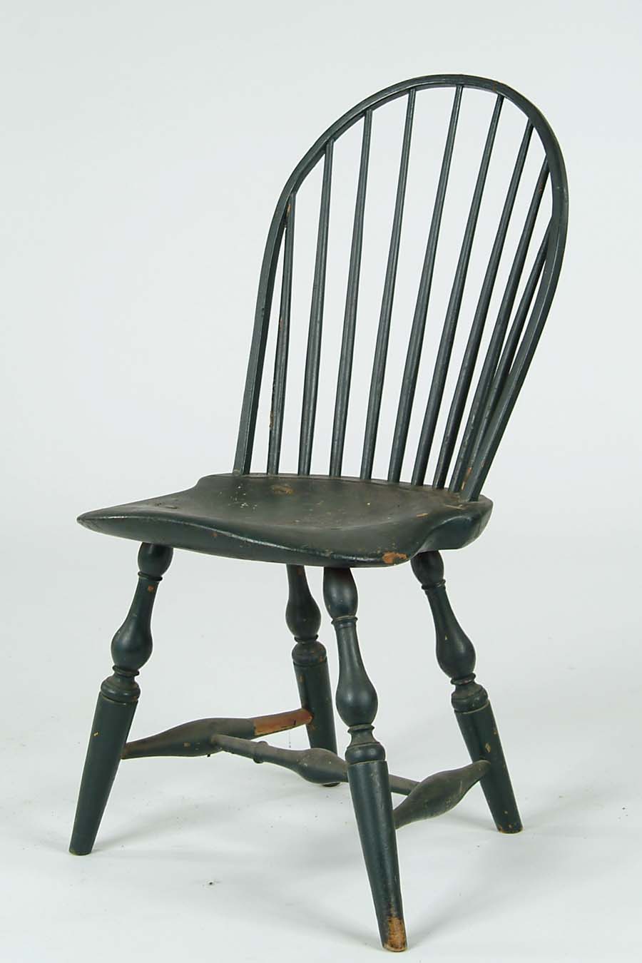 Appraisal: WINDSOR BOW BACK SIDE CHAIR IN GREEN PAINT Nine spindle