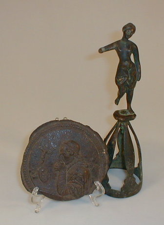 Appraisal: A bronze plaque AF and a bronze figure on an