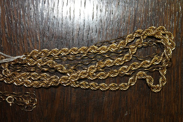 Appraisal: A CT GOLD CHAIN of rope-twist form together with a