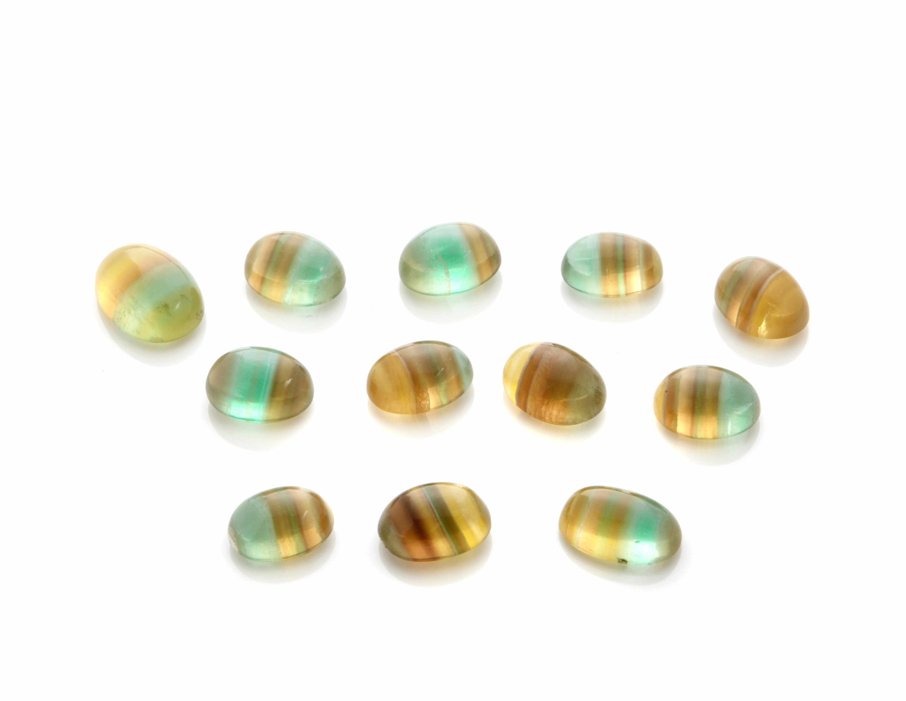 Appraisal: Group of Fluorite Cabochons Argentina Twelve oval cabochons having vivid