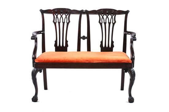 Appraisal: GEORGIAN CHIPPENDALE MAHOGANY DOUBLE-CHAIRBACK SETTEE late 's Carved crestrail pierced