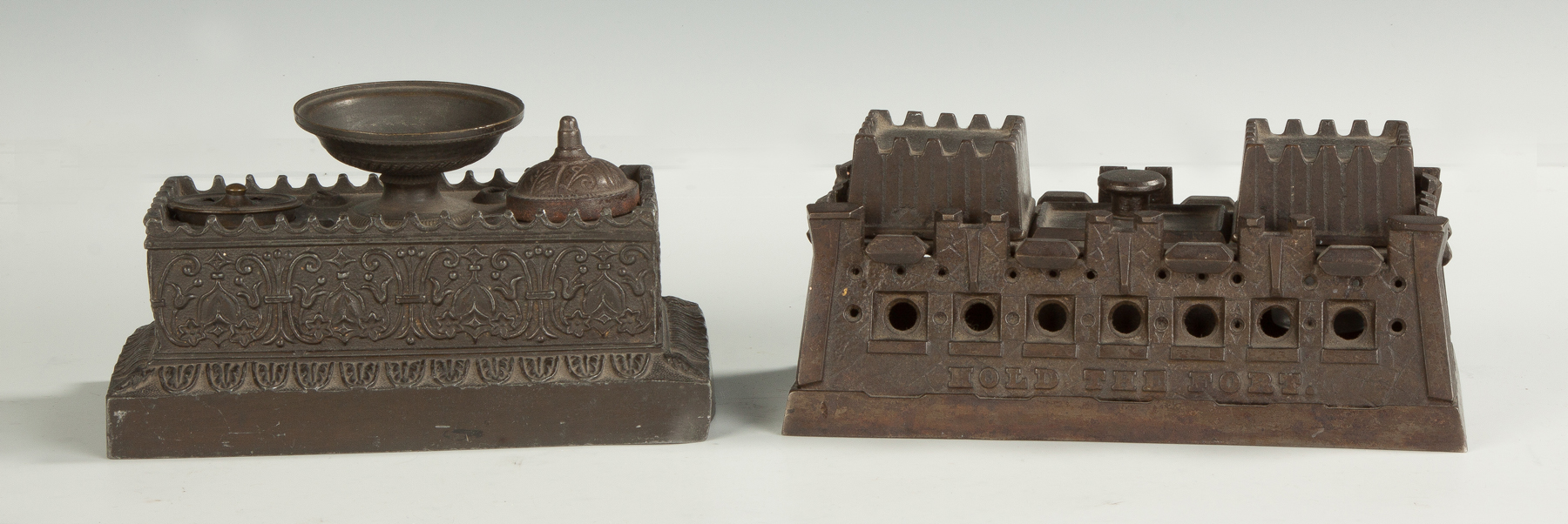 Appraisal: Two Fort Shaped Cast Iron Desk Sets late th cent