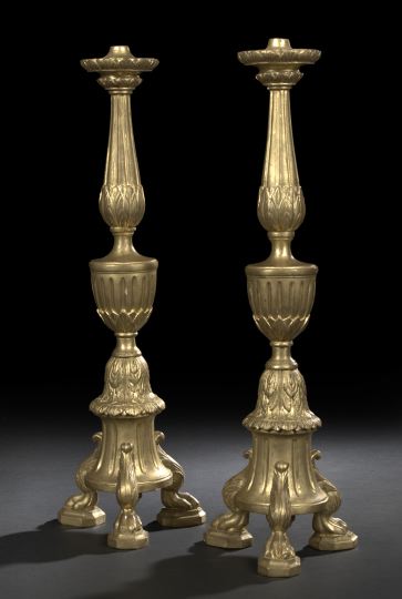 Appraisal: Pair of Italian Carved Giltwood Tripodal Pricket Candlesticks in the