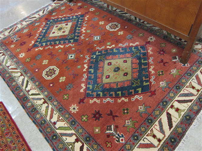 Appraisal: HAND KNOTTED ORIENTAL CARPET Persian tribal design featuring a pair