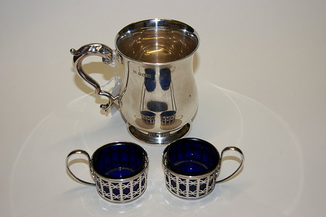 Appraisal: A SILVER CHRISTENING MUG Birmingham and a pair of silver