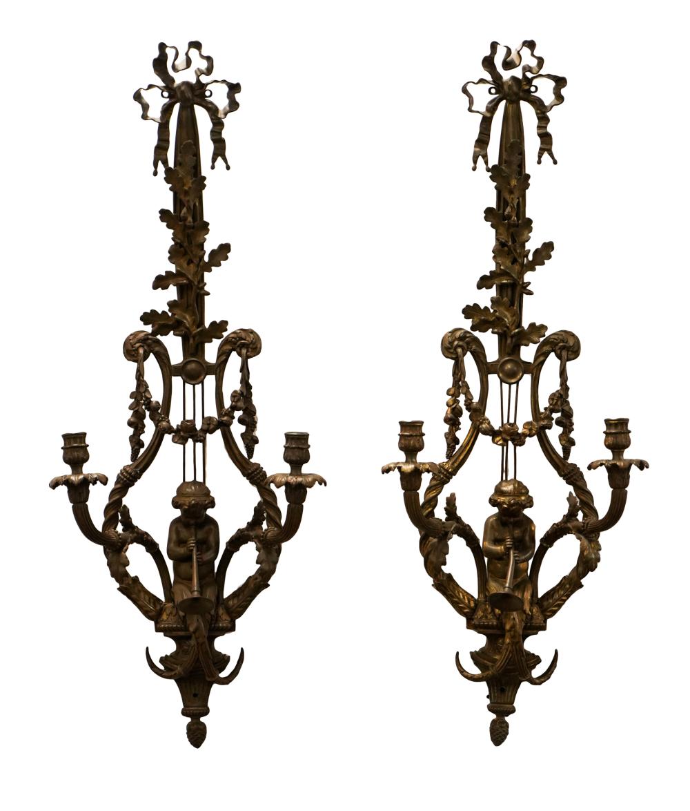 Appraisal: PAIR OF ROCOCO-STYLE TWIN-LIGHT WALL SCONCESgilt metal each cast with