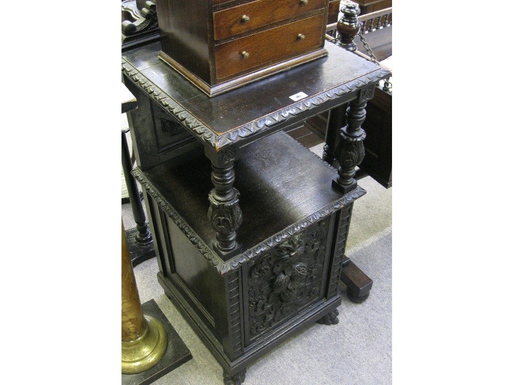 Appraisal: Ebonised and ornately carved coal scuttle with columns and upperstage