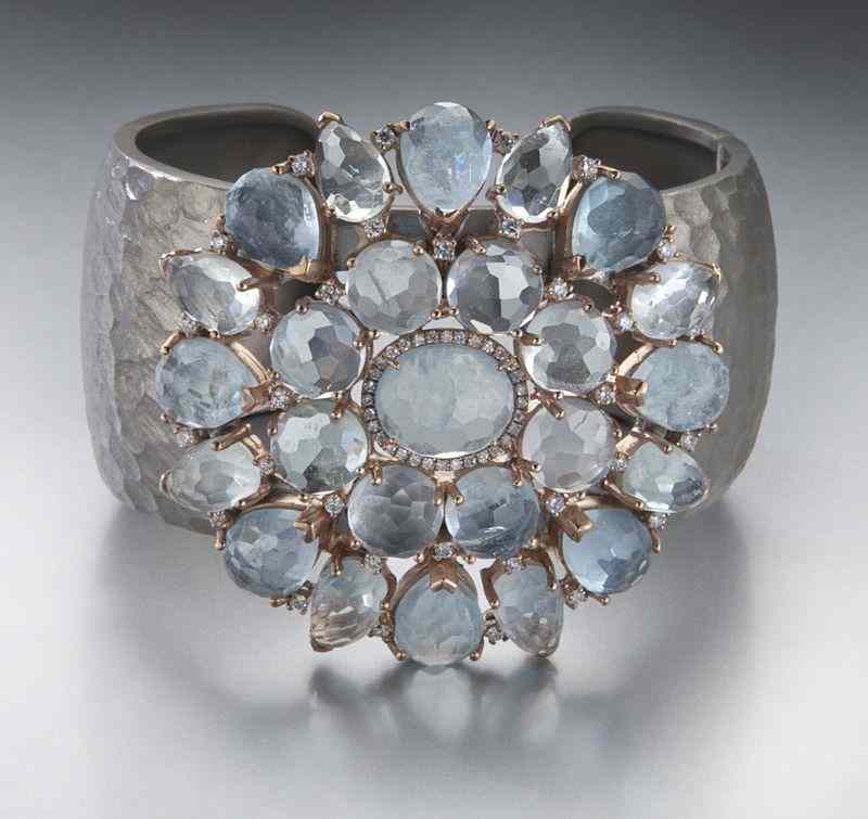 Appraisal: Sterling silver and aquamarine cuff bracelet featuring faceted aquamarines in