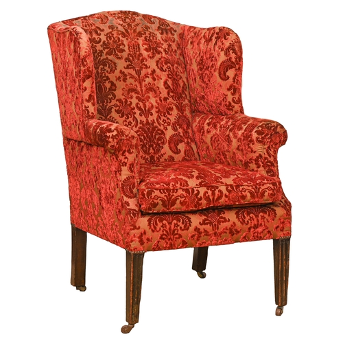 Appraisal: A George III mahogany wing-back armchair on moulded square tapering