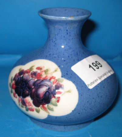 Appraisal: Moorcroft Vase decorated with floral panels on powder blue ground