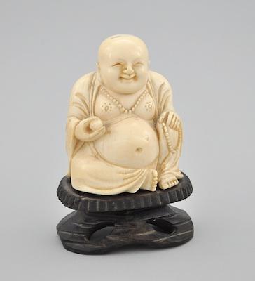 Appraisal: A Carved Ivory Figure of Seated Buddha Carved ivory depicting