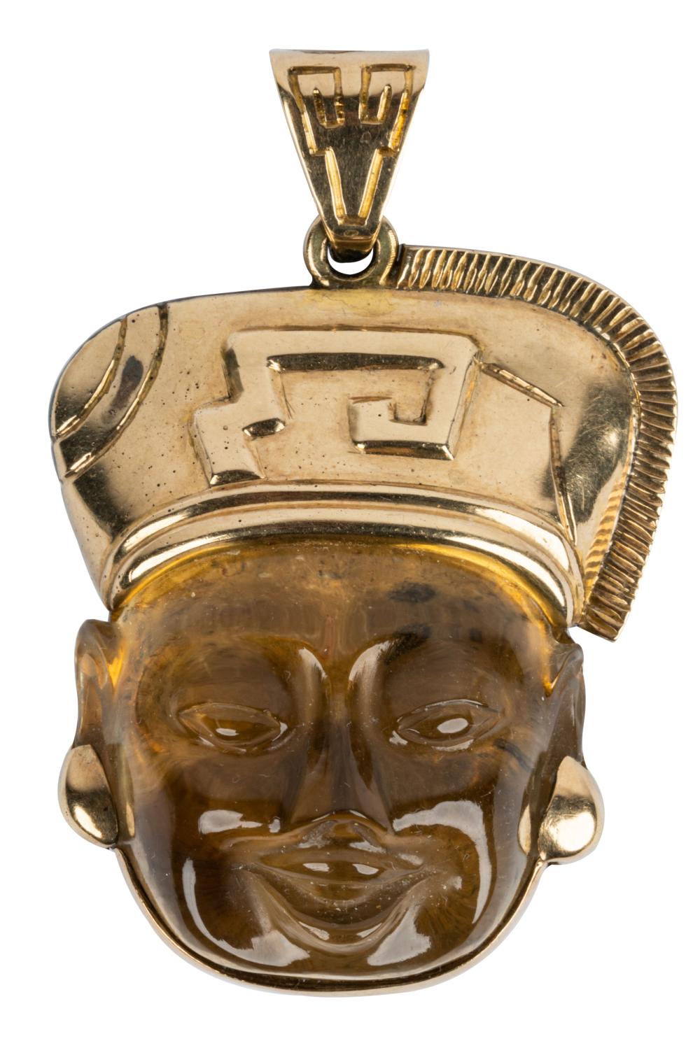 Appraisal: KARAT YELLOW GOLD CITRINE HEAD PENDANTcentering one freeform carved citrine