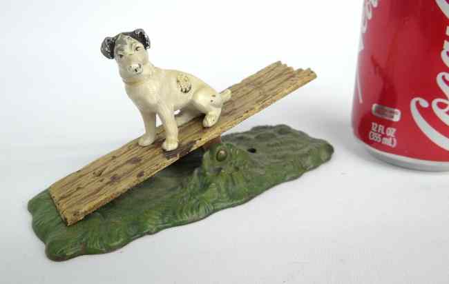 Appraisal: C cast iron polychrome painted dog on teeter totter paper