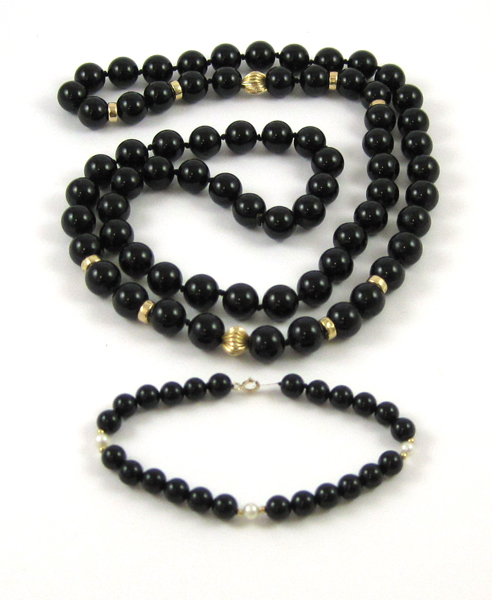 Appraisal: ONYX BEADED NECKLACE AND BRACELET the necklace consisting of spherical