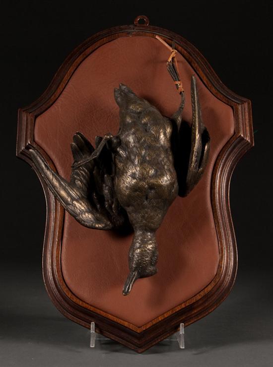 Appraisal: Continental patinated bronze game bird figure mounted on leather and