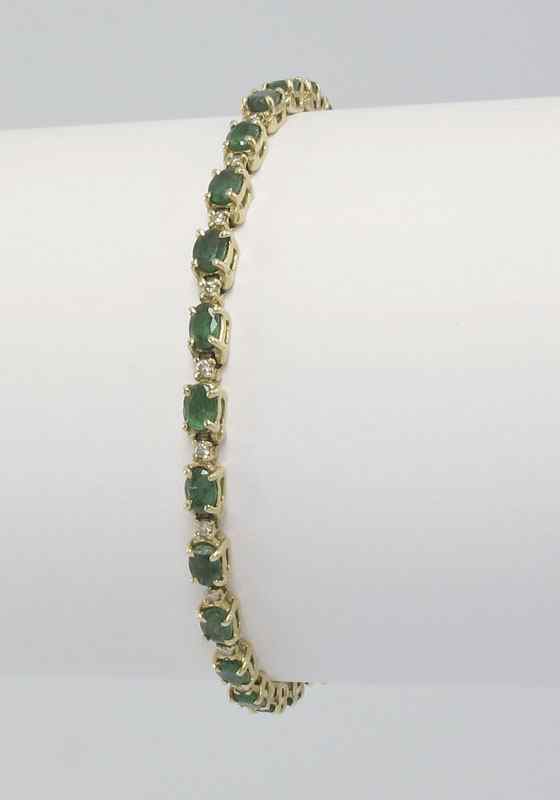 Appraisal: K EMERALD DIAMOND BRACELET K yellow gold bracelet contains oval