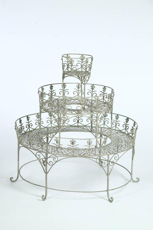 Appraisal: IRON PLANTER Three tiered cream painted planter with pierced floral