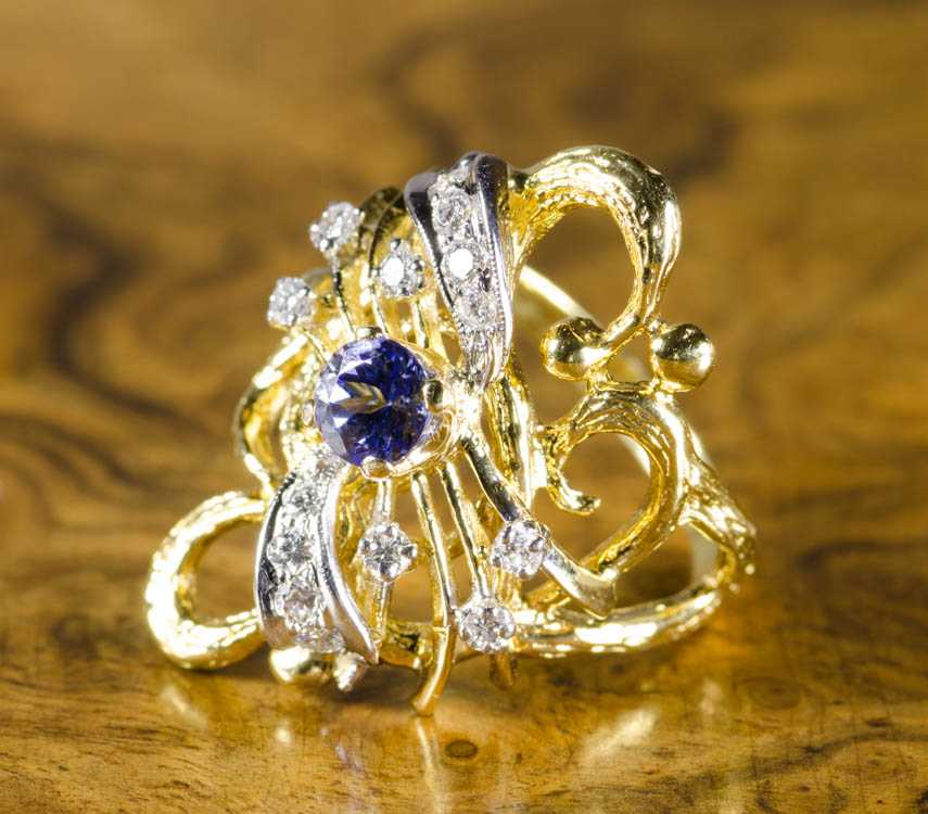 Appraisal: TANZANITE DIAMOND AND FOURTEEN KARAT GOLD RING The yellow and