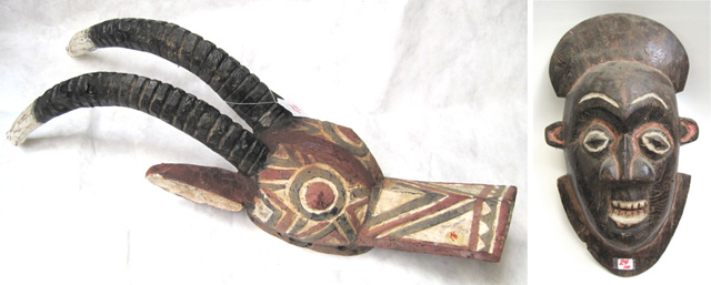 Appraisal: TWO WOODEN HAND CARVED AFRICAN MASKS the first from the