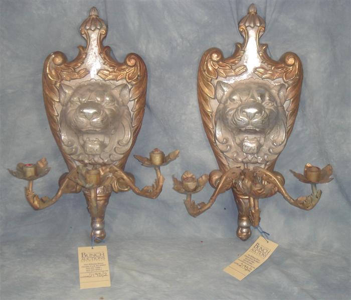 Appraisal: Pair of composition metal lion head wall sconces h Estimate