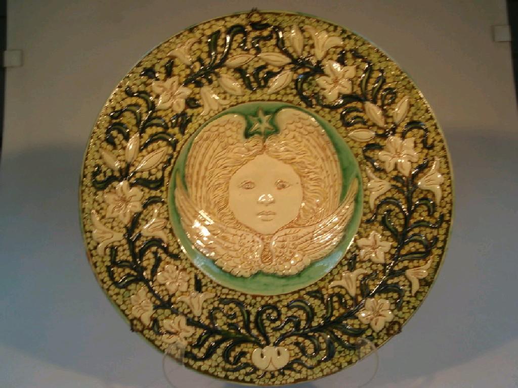 Appraisal: A Della Robbia pottery charger by Liza Wilkins the dished