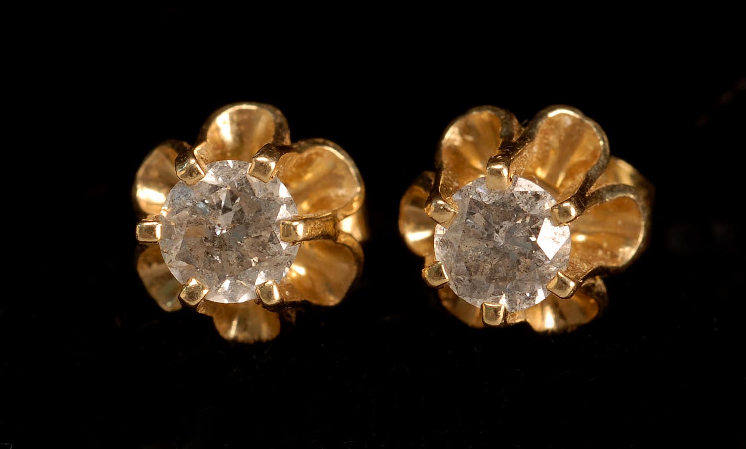 Appraisal: PAIR OF YELLOW GOLD AND DIAMOND STUD EARRINGS Mounted in